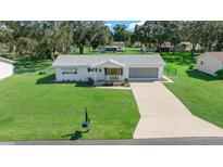 Single story home with a large front yard at 11217 Sw 76Th Ter, Ocala, FL 34476