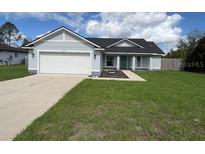 Newly constructed home with a two-car garage at 468 Marion Oaks Blvd, Ocala, FL 34473