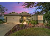 Charming one-story home with landscaping and two-car garage at 9436 Sw 97Th Ave, Ocala, FL 34481