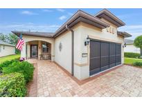 Single-story home with a two-car garage and landscaped front yard at 9114 Sw 73Rd St, Ocala, FL 34481