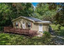 House exterior with deck and landscaped yard at 2150 Se 185Th Ter, Silver Springs, FL 34488