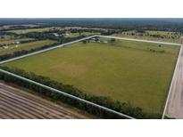 Aerial view of expansive property with a home and large pasture at 3550 Sw 210Th Ave, Dunnellon, FL 34431