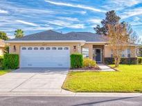 Charming single-story home with attached garage and landscaped front yard at 8327 Sw 79Th Cir, Ocala, FL 34476