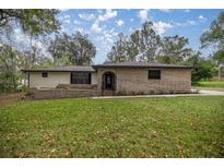 Brick ranch home with landscaped yard and driveway at 4121 Sw 6Th Ave, Ocala, FL 34471