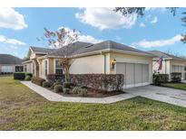 Charming single-story home with a well-maintained front yard and attached garage at 7102 Sw 91St Ct, Ocala, FL 34481