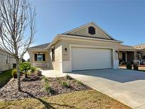 One-story home with attached garage and landscaped front yard at 7883 Sw 89Th Cir, Ocala, FL 34481