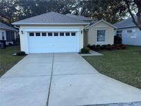 One-story house with attached garage and well-manicured lawn at 10913 Sw 69Th Cir, Ocala, FL 34476