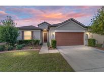 One-story home with attached garage, landscaping, and walkway at 6622 Sw 97Th Terrace Rd, Ocala, FL 34481
