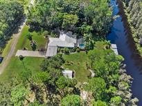 Aerial view showcasing house, expansive lot, and waterfront access at 6168 Arborea Dr, Lake Wales, FL 33898