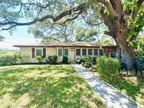 Charming ranch home with mature landscaping and a spacious yard at 140 Auburn Rd, Auburndale, FL 33823