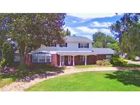 Two-story house with brick and white siding, large yard at 1950 El Paso Trl, Bartow, FL 33830