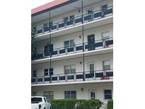 Exterior view of a multi-story building at 200 El Camino Dr # 411, Winter Haven, FL 33884
