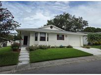 House exterior with landscaping and driveway at 3130 Prairie Dunes W Cir, Lakeland, FL 33810