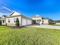 Single-Gathering home with three-car garage and manicured lawn at 1793 Lakehill Dr, Winter Haven, FL 33884