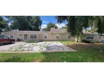 Ranch style home with flagstone patio and landscaping at 2031 Poe St, Lakeland, FL 33801