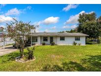 Charming single story home with carport and spacious lawn at 205 Avenue U Nw, Winter Haven, FL 33881