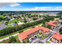 Aerial view of community featuring various housing styles and landscape at 902 Charo Pkwy # 624, Davenport, FL 33897