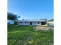 Single-story home with metal roof and green lawn at 714 Hillside Ave, Lake Wales, FL 33853