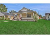 Charming bungalow with a large front yard and porch at 816 W Hancock St, Lakeland, FL 33803