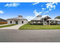 Two-story home with metal roof and large yard at 29 Turtle Ln, Haines City, FL 33844