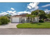 Single-story home with a one-car garage and well-maintained lawn at 4234 Cerimen St, Lake Wales, FL 33898