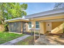 House exterior with screened porch and carport at 618 Booker Ave, Lake Wales, FL 33853