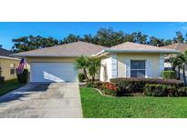 Charming single-story home with a well-manicured lawn at 708 Canberra Rd, Winter Haven, FL 33884