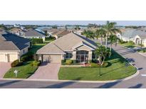 Single-Gathering home with 2-car garage, view of lake at 3820 Traditions N Blvd, Winter Haven, FL 33884