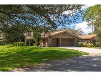 Single-story home with attached two-car garage and manicured lawn at 109 Odin Dr, Winter Haven, FL 33884