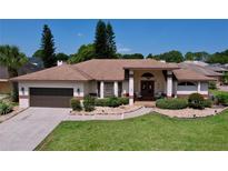Single-story home with a two-car garage and manicured lawn at 209 Santa Rosa Dr, Winter Haven, FL 33884