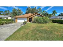 Single-story house with attached garage and well-manicured lawn at 222 Okaloosa Dr, Winter Haven, FL 33884