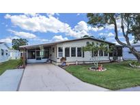 Mobile home with carport and landscaping at 1717 Quail Hill Dr, Lakeland, FL 33810