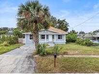 Charming bungalow with gray siding, and palm tree at 1800 4Th Nw St, Winter Haven, FL 33881