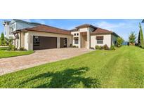 Luxury home with two-car garage and landscaping at 193 Stargrass Dr, Auburndale, FL 33823