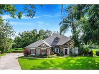 One-story house exterior with stone accents at 11 Lefe Ct, Haines City, FL 33844