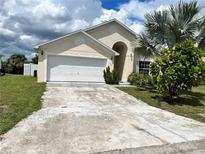 House exterior with driveway and landscaping at 123 Osprey Heights Dr, Winter Haven, FL 33880