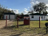 Ranch style home with detached garage and fenced yard at 37 Hall St, Lake Wales, FL 33898