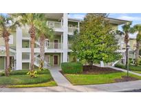 Inviting condo building with lush landscaping and private entrance at 805 Gran Bahama Blvd # 805, Davenport, FL 33897