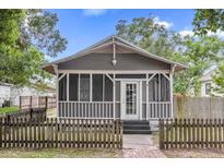 Charming craftsman home with a front porch and picket fence at 1004 S Laurel Ave, Sanford, FL 32771