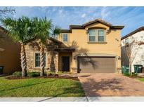 Two story home with brick and stone accents at 8909 Bengal Ct, Kissimmee, FL 34747