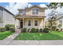 Two-story house with front porch at 6943 Cupseed Ln, Harmony, FL 34773
