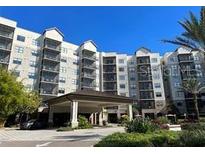 Luxury condominium building with covered entryway at 14501 Grove Resort Ave # 3535, Winter Garden, FL 34787