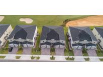 Aerial view of townhouses with a golf course view at 769 Ocean Course Ave # 769, Davenport, FL 33896