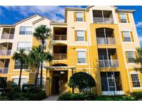 Exterior view of a three-story condo building at 3338 Robert Trent Jones Dr # 20904, Orlando, FL 32835