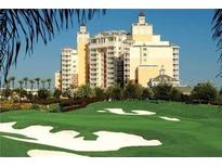 High-rise building with a classic design, overlooking a golf course at 7593 Gathering Dr # 907, Reunion, FL 34747