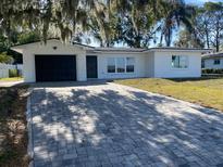 Charming ranch home with a paver driveway at 1204 Lake Elbert Se Dr, Winter Haven, FL 33880