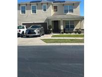 Two-story house with solar panels and a two-car garage at 3181 Royal Tern Dr, Winter Haven, FL 33881