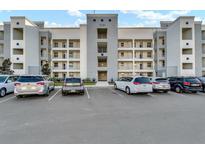 Modern building exterior with ample parking and convenient curbside access at 3131 Paradox Circle # 207, Kissimmee, FL 34746
