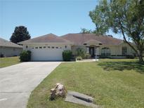 One-story home with attached garage and landscaped yard at 4572 Nw 32Nd St, Ocala, FL 34482