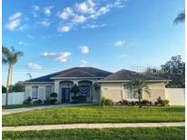 House exterior showcasing a two-story home with a landscaped yard at 7953 Sea Pearl Cir, Kissimmee, FL 34747